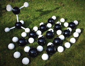 Reusable balls and rods on a lawn for giant molecular model kits with a model of ethane